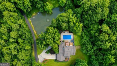 Situated on over an acre, this exceptional 5-bedroom, 4.5-bath - photo 10