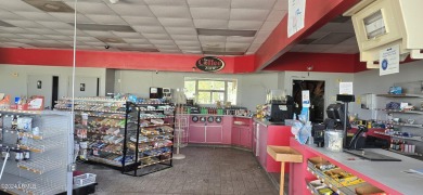 Prime location! Building in place with a new roof with gas tanks