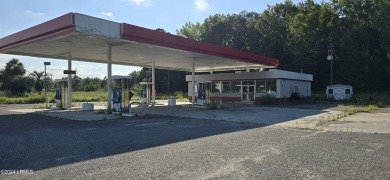 Prime location! Building in place with a new roof with gas tanks