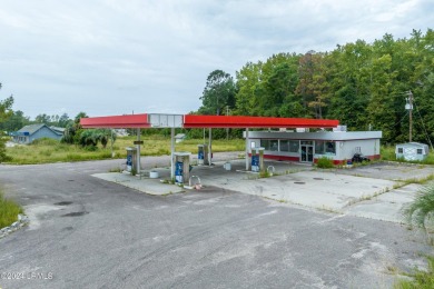 Prime location! Building in place with a new roof with gas tanks