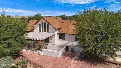 With a gorgeous backdrop of Granite Mountain, this Prescott home