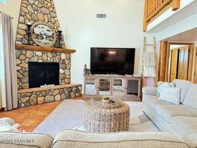 With a gorgeous backdrop of Granite Mountain, this Prescott home