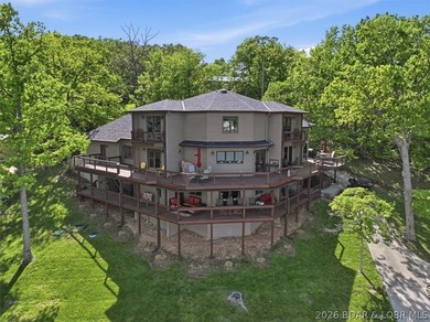 Vaulted ceilings, walls of windows, and wood-burning fireplace - photo 2