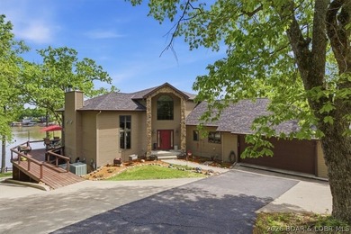 Vaulted ceilings, walls of windows, and wood-burning fireplace - photo 4