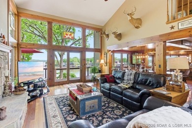 Vaulted ceilings, walls of windows, and wood-burning fireplace - photo 7