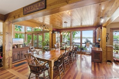 Vaulted ceilings, walls of windows, and wood-burning fireplace - photo 10