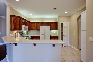 Desirable and beautifully maintained one-level townhome in