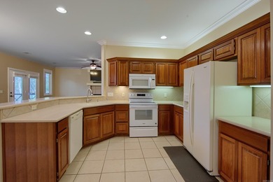 Desirable and beautifully maintained one-level townhome in