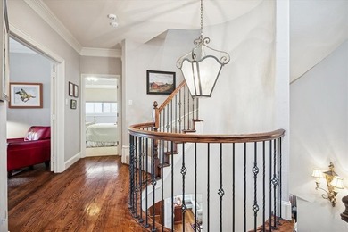 Welcome to refined, lock-and-leave luxury in this stunning