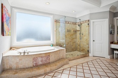 Welcome to refined, lock-and-leave luxury in this stunning