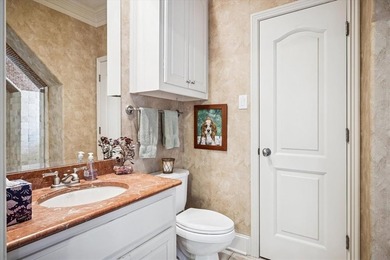 Welcome to refined, lock-and-leave luxury in this stunning