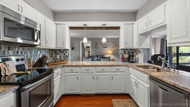 Turnkey Lakefront Living with a Dock Slip Included! Discover - photo 1