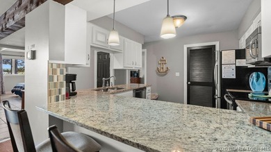 Turnkey Lakefront Living with a Dock Slip Included! Discover - photo 8