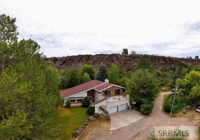 Tucked off Rapid Creek Road behind mature trees and beneath - photo 1