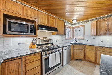 One-of-a-kind custom half log sided home on 24.5 wooded acres - photo 11