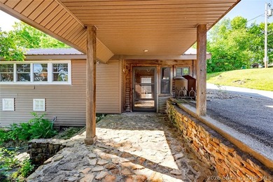 Originally a Quonset hut, this unique lakefront property blends - photo 3