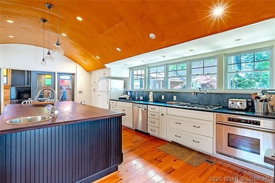Originally a Quonset hut, this unique lakefront property blends - photo 9