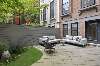 A renovated two-family townhouse nestled less than two blocks - photo 12