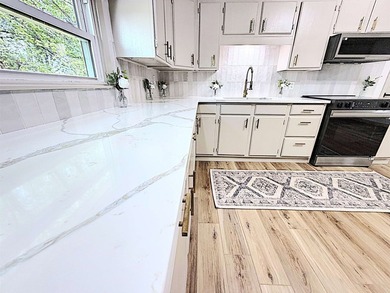Completely updated sprawling 4 bedroom 2 bath ranch in the - photo 12