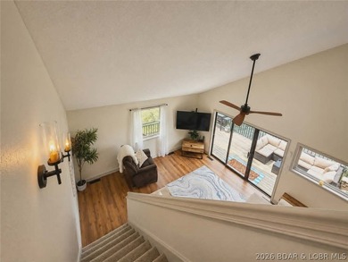 Step inside to vaulted ceilings and a stunning primary suite - photo 3