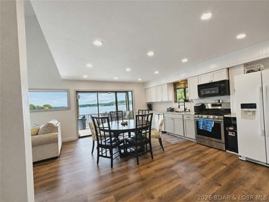 Step inside to vaulted ceilings and a stunning primary suite - photo 4