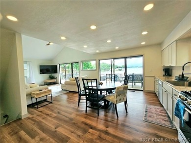 Step inside to vaulted ceilings and a stunning primary suite - photo 5