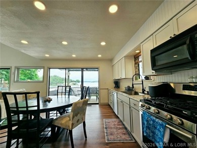 Step inside to vaulted ceilings and a stunning primary suite - photo 7