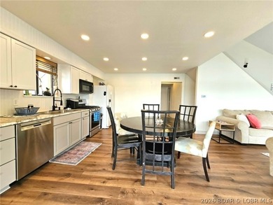 Step inside to vaulted ceilings and a stunning primary suite - photo 9