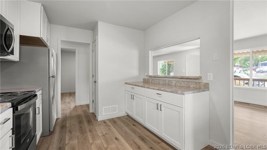 Completely remodeled and move-in ready, this in-town home offers - photo 10