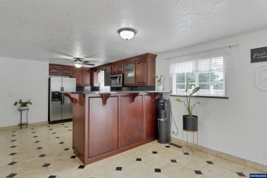 Ready to enjoy this perfectly manicured front yard & beautiful