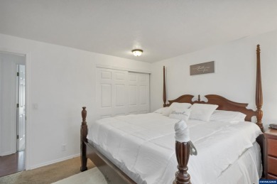 Ready to enjoy this perfectly manicured front yard & beautiful