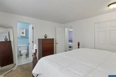 Ready to enjoy this perfectly manicured front yard & beautiful