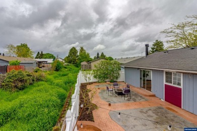 Ready to enjoy this perfectly manicured front yard & beautiful