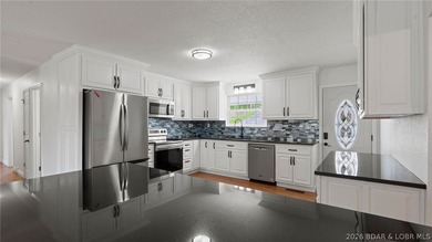 Enjoy lakefront living at its best in this beautifully remodeled - photo 3