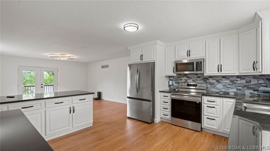 Enjoy lakefront living at its best in this beautifully remodeled - photo 7