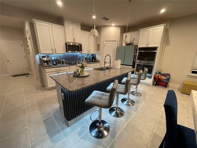 Built in 2023, this beautifully upgraded 5-bedroom, 3-bath home - photo 4