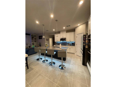 Built in 2023, this beautifully upgraded 5-bedroom, 3-bath home - photo 9