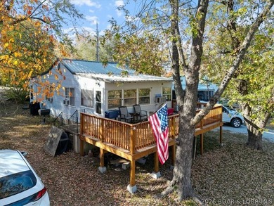 Escape to this 2 bed, 1 bath lakeside retreat located on 3 - photo 1