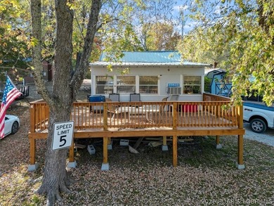 Escape to this 2 bed, 1 bath lakeside retreat located on 3 - photo 2