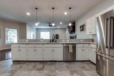 Set on nearly an acre (MOL) in Northwood Lake Estates, this - photo 12