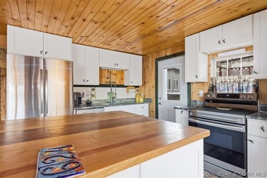 Charming lakefront cabin delivers the perfect blend of - photo 10