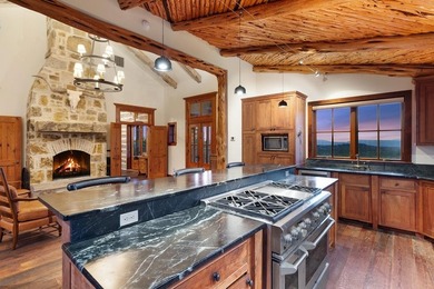 At the heart of the ranch lies a custom two-story home, built in - photo 11