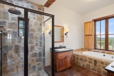 At the heart of the ranch lies a custom two-story home, built in - photo 24