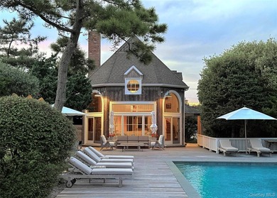 A rare and compelling offering along coveted Dune Road, this - photo 4