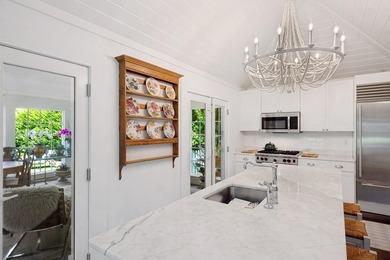 This Southampton Village Cape cod cottage encapsulates the - photo 5