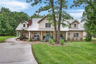Set on a beautifully landscaped, nearly one-acre lot in The - photo 3