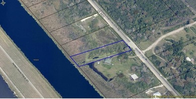 Prime waterfront property featuring 2 acres on the Rim Canal - photo 3
