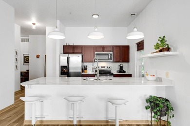 Welcome home to Unit 101 at Greenway Terrace Condominiums, where - photo 1