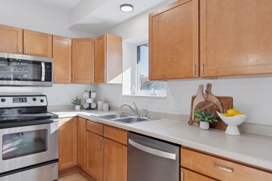 Step into this beautifully updated corner unit featuring fresh