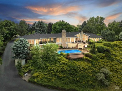 Nestled on a sprawling 4.5-acre estate, this breathtaking - photo 3